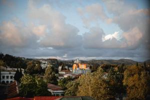 a view of a city with a cloudy sky at Apartment Kutaisi 248 in Kutaisi