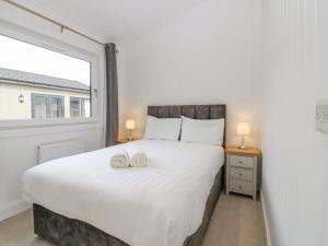 מיטה או מיטות בחדר ב-Lodge 18 - Ruthven Hideaway