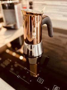 a coffee pot sitting on top of a counter at Apartment Vitale in Bologna