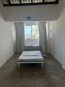 A bed or beds in a room at Dip N Doze