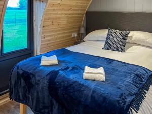 a bedroom with a bed with two towels on it at Vale View - Uk43774 in South Barrow