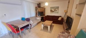 a living room with a couch and a table at Triblex Villa I Private Beach I Walking Distance to the Sea 300 meters in Side