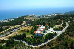 an aerial view of a house on a hill with a road at Philoxenia in Kavála