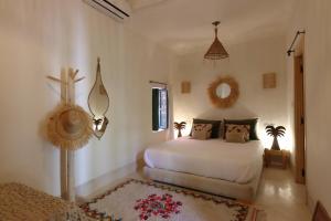 a bedroom with a bed in a room at Riad NaaNaa Bed & Breakfast in Marrakech