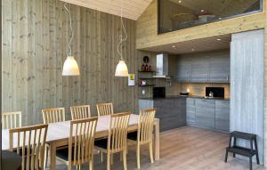 a kitchen with a dining room table and chairs at Gorgeous Home In Bjorli With House A Panoramic View in Bjorli