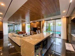 a large living room with a couch and a table at Song Cat villa - 49DP8 in Danang
