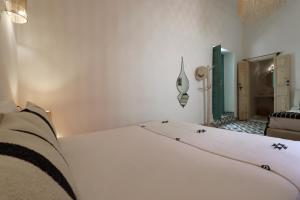 Postel nebo postele na pokoji v ubytování Riad NaaNaa Bed & Breakfast