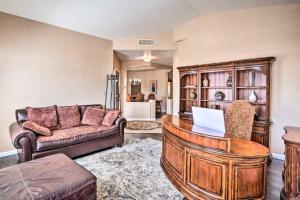 a living room with a couch and a table at Private Tuscany Oasis with Pool - Perfect for families, couples or business travelers home in Phoenix