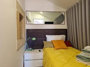 Postel nebo postele na pokoji v ubytování Coliving The VALLEY Portugal countryside retreat for digital nomads and hiking lovers - PRIVATE BEDROOMS with SHARED BATHROOMS, shared kitchen, and coworking space