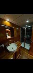 a bathroom with a sink and a bath tub at Bluemarmarisgulettour in Marmaris