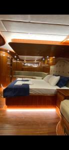 a large bed on a boat in a room at Bluemarmarisgulettour in Marmaris