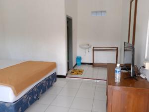 Letto o letti in una camera di Hotel Tentrem Syariah