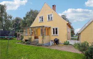 a house under construction in a yard at Beautiful Home In Faaborg With Wifi in Faaborg