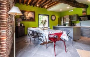 a kitchen and dining room with a table and chairs at Awesome Home In Paluel With Wifi And 3 Bedrooms in Paluel