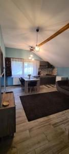 a living room with a ping pong table in it at Comfort Home Apartment 3 in Petroşani