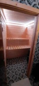 a room with a sauna in a room with at Casa Bella in Vadu Moţilor