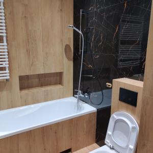 Kúpeľňa v ubytovaní Apartament Perła Kutna