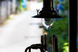 a drop of water hanging from a light fixture at GuestHouse Azito in Hakone