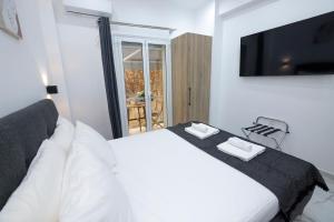 Ένα ή περισσότερα κρεβάτια σε δωμάτιο στο Apollo 2 bd Jacuzzi Suite