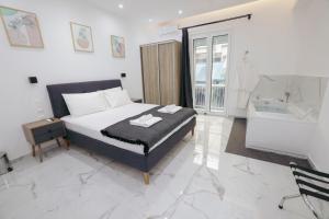 Postel nebo postele na pokoji v ubytování Apollo 2 bd Jacuzzi Suite