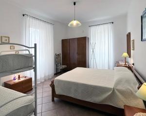 a bedroom with a bed and a bunk bed at Barzio Village Hideaway in Barzio