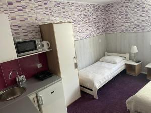 Posteľ alebo postele v izbe v ubytovaní Apartamenty Konopnicka