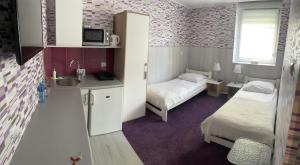 Posteľ alebo postele v izbe v ubytovaní Apartamenty Konopnicka