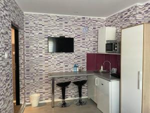 Kuchyňa alebo kuchynka v ubytovaní Apartamenty Konopnicka