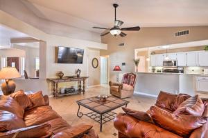 a living room with a couch and a table at Private Tuscany Oasis with Pool - Perfect for families, couples or business travelers home in Phoenix