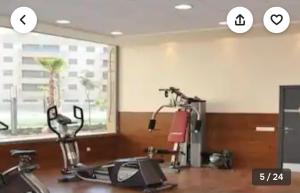 a gym with two exercise bikes and a window at Apartamento en Urbanización de lujo con piscina, gimnasio y spa Aparcamiento GRATIS en la zona in Córdoba