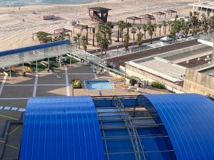 an aerial view of a beach and a building at Apartments 1126 Colony Beach with Pool Bat Yam Tel Aviv in Bat Yam