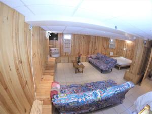 an overhead view of a living room with wooden walls at Studio 50 M2 15MN de Paris in Villeneuve-le-Roi