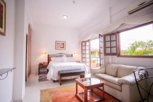سرير أو أسرّة في غرفة في Hotel Santo Domingo