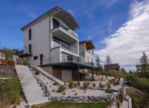 a house on a hillside with a garden at KANANI am Hainer See in Neukieritzsch