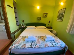 Postel nebo postele na pokoji v ubytování Notti Etrusche a Sovana