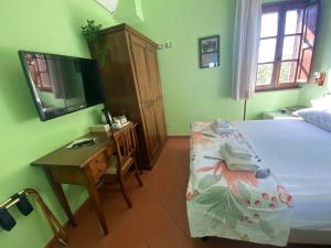 Postel nebo postele na pokoji v ubytování Notti Etrusche a Sovana