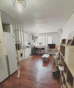 an empty room with a kitchen and a living room at Heukseok Town House in Seoul