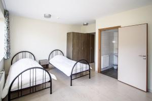 Postel nebo postele na pokoji v ubytování J-Club De Knapzak / La Besace