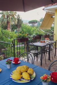 a table with a blue table cloth and a plate of food at B&B Massico Apartments in Sant'Agnello
