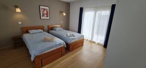 Ένα ή περισσότερα κρεβάτια σε δωμάτιο στο Quinta Coração d'Ouro