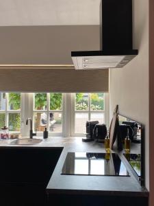 a kitchen with a sink and a counter top at Tukken op de Tol in Velp