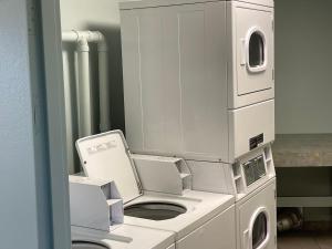 a machine in a room with a washing machine at Casa Del Mar Sun Diamond One Bedroom Retreat - Galveston in Galveston