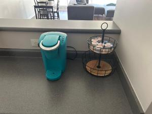 a counter with two baskets and a trash can at Luxury loft in the heart of downtown Memphis in Memphis