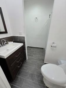 a bathroom with a sink and a toilet at Cantares Adults Only in Cancún