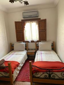 Ένα ή περισσότερα κρεβάτια σε δωμάτιο στο Appartement dans résidence avec piscine