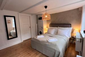 Postel nebo postele na pokoji v ubytování Carolinas Apartments - Gammelmønt 1