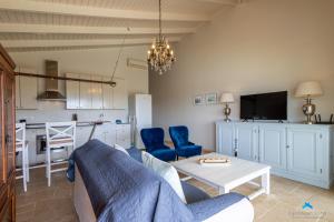 a living room with a couch and a table at Marina view apartments in Kralendijk