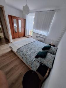 Кровать или кровати в номере Apartament Maria