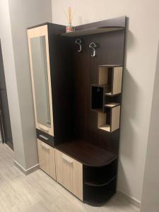 a bathroom cabinet with a mirror and a sink at Brown Mur in Sofia