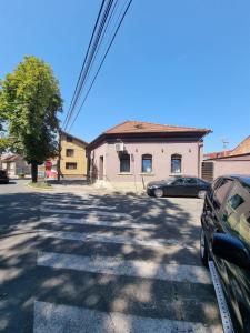 a street with a car parked in a parking lot at Laci lak modern apartment in Oradea
